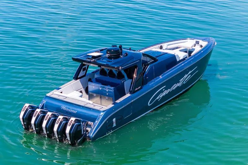 The Image of 2024 Cigarette 42' Auroris boat with multiple engines on clear blue water. - 0