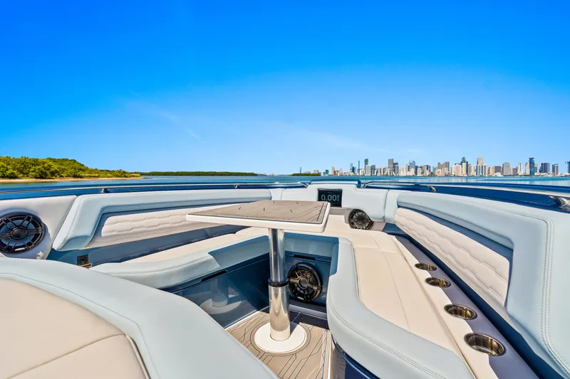 Slide: The Image of 2024 Cigarette 42' Auroris luxury boat interior with city skyline and blue sky. - 10