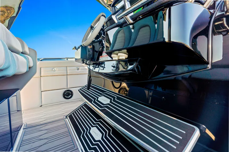 Slide: The Image of 2024 Cigarette 42' Auroris boat interior with sleek design and modern controls. - 15