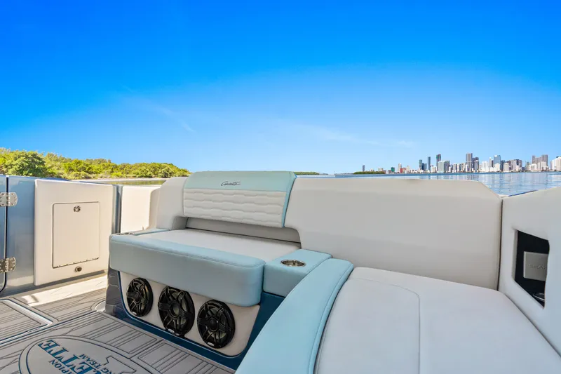 Slide: The Image of 2024 Cigarette 42' Auroris luxury boat interior with city skyline view. - 22