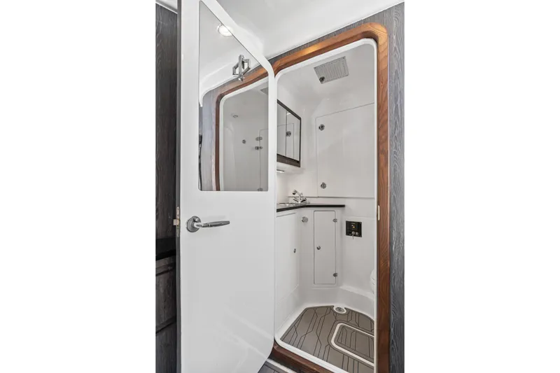Slide: The Image of 2024 Cigarette 42' Auroris boat bathroom with sleek design and modern fixtures. - 27