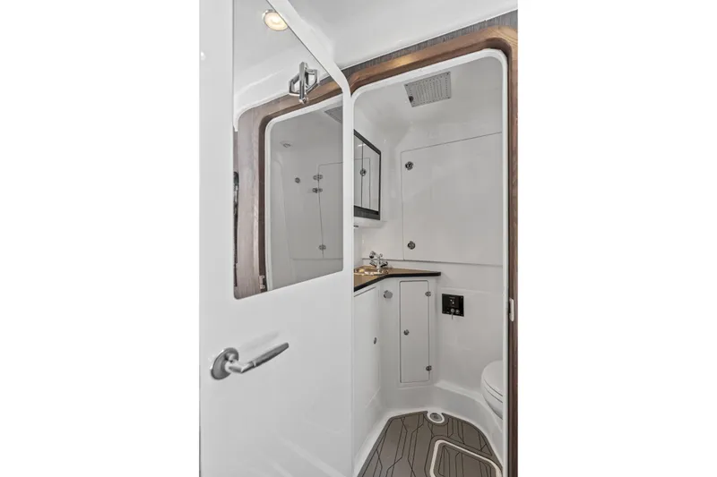Slide: The Image of Luxurious bathroom interior of 2024 Cigarette 42' Auroris yacht, featuring modern fixtures and sleek design. - 28