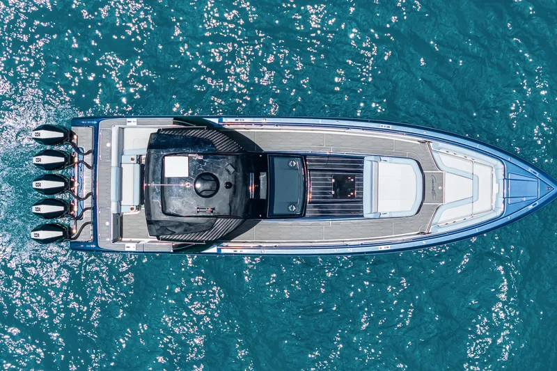 Slide: The Image of Top view of 2024 Cigarette 42' Auroris yacht on sparkling blue water. - 5