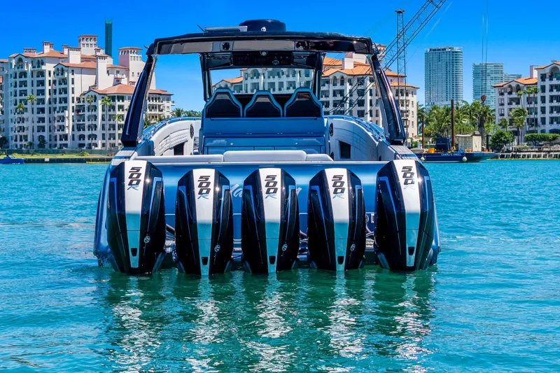 Slide: The Image of 2024 Cigarette 42' Auroris boat with multiple engines on turquoise water. - 6