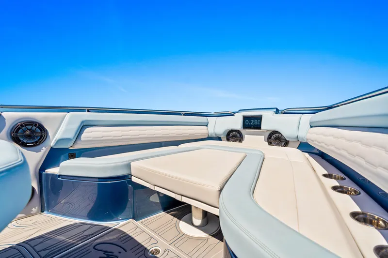 Slide: The Image of 2024 Cigarette 42' Auroris boat interior with luxurious seating and modern dashboard. - 9