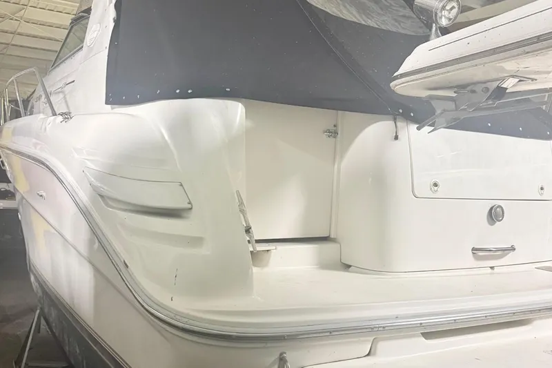 Slide: The Image of Rear view of a 1996 Sea Ray Sundancer 330 yacht indoors. - 16