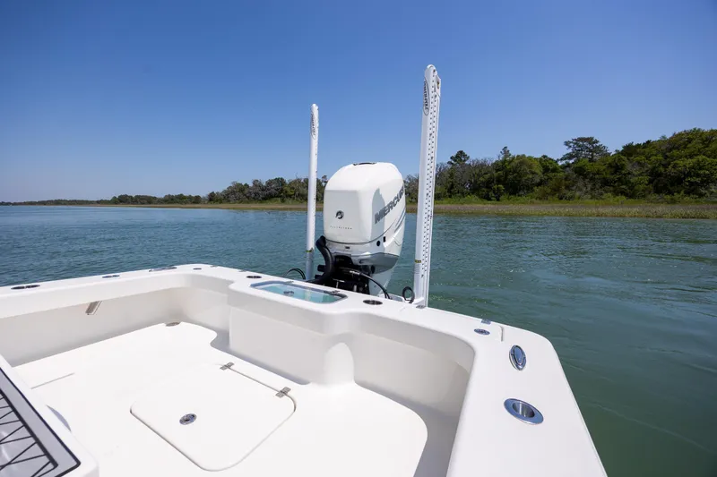 Slide: The Image of ZCB Freemason 26 boat, 2022 model, on calm water with clear blue sky. - 11