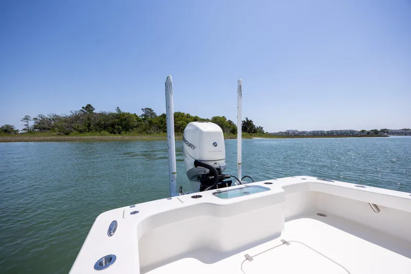 Slide: The Image of Boat on calm water with Mercury engine, ZCB Freemason 26, 2022 model, scenic shoreline view. - 14