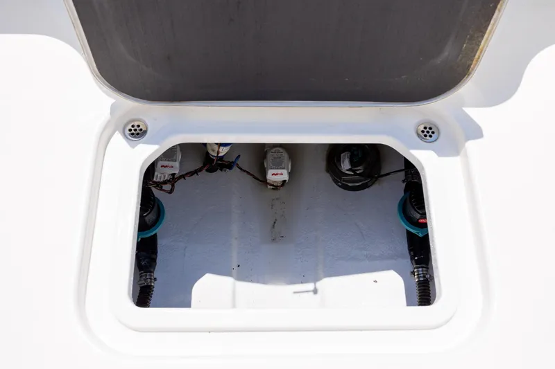 Slide: The Image of Open hatch of 2022 ZCB Freemason 26 boat showing internal components. - 18