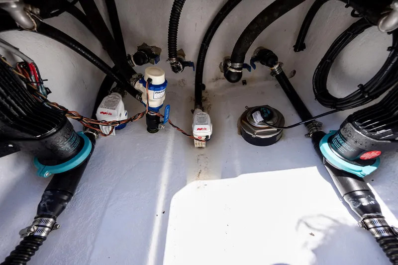 Slide: The Image of Boat engine compartment with wiring and hoses, ZCB Freemason 26, 2022 model. - 19