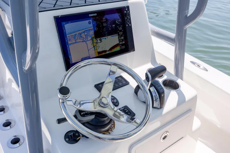 Slide: The Image of Steering console of 2022 ZCB Freemason 26 boat with navigation display. - 27
