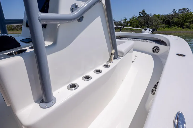 Slide: The Image of 2022 ZCB Freemason 26 boat interior with sleek white design and stainless steel fixtures. - 29