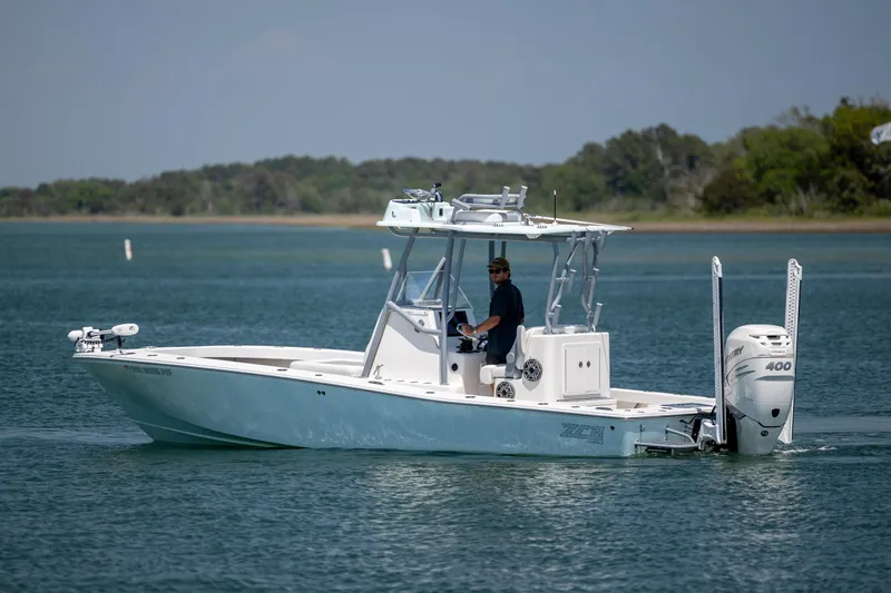 Slide: The Image of 2022 ZCB Freemason 26 boat cruising on calm waters with a Mercury 400 engine. - 3