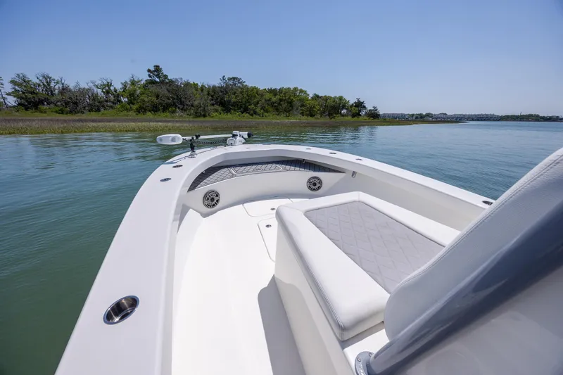 Slide: The Image of Bow view of 2022 ZCB Freemason 26 boat on calm water. - 31