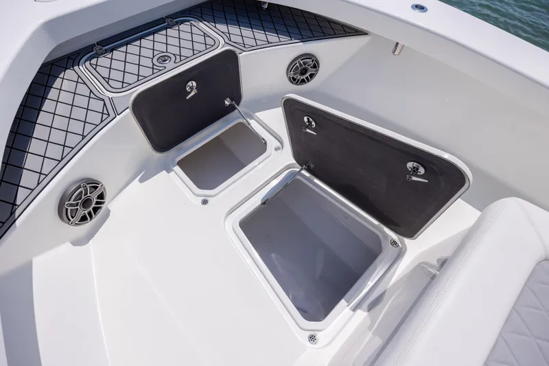 Slide: The Image of Open storage compartments on a 2022 ZCB Freemason 26 boat deck. - 39