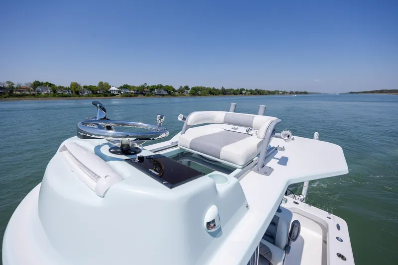 Slide: The Image of 2022 ZCB Freemason 26 boat on calm water, featuring sleek design and comfortable seating. - 44