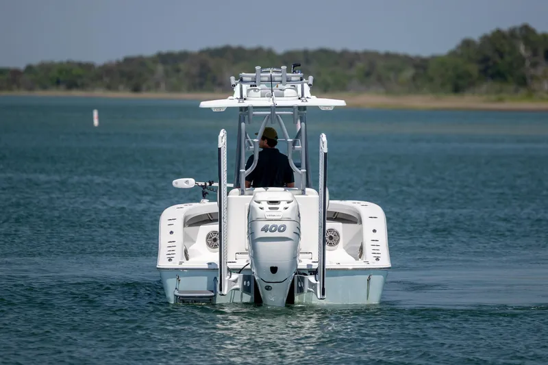 Slide: The Image of 2022 ZCB Freemason 26 boat cruising on a calm lake. - 5