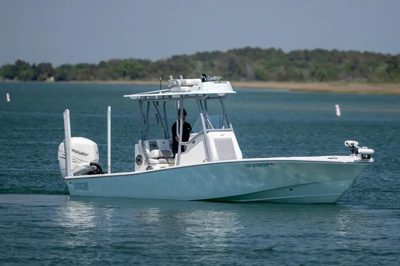 Slide: The Image of ZCB Freemason 26 boat cruising on a calm lake, 2022 model. - 9