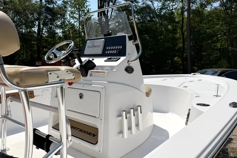 Slide: The Image of 2017 Sportsman Masters 207 Bay Boat with Garmin navigation, beige seating, and sleek console design. - 6