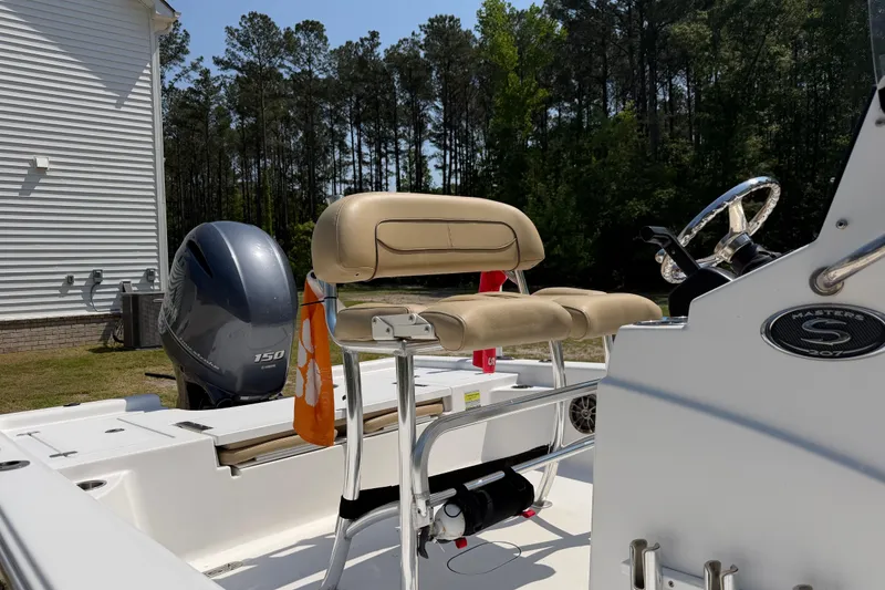 Slide: The Image of 2017 Sportsman Masters 207 Bay Boat with Yamaha 150 engine, parked outdoors. - 9