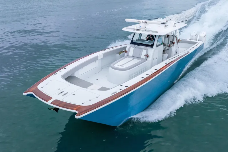 Slide: The Image of 2024 Freeman 47 boat cruising on water, showcasing sleek design and advanced features. - 11