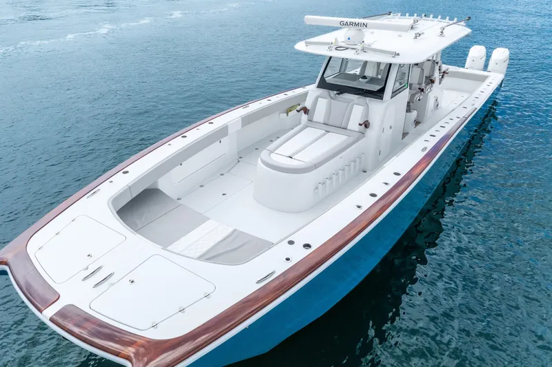 Slide: The Image of 2024 Freeman 47 boat on water, featuring sleek design and advanced navigation equipment. - 18