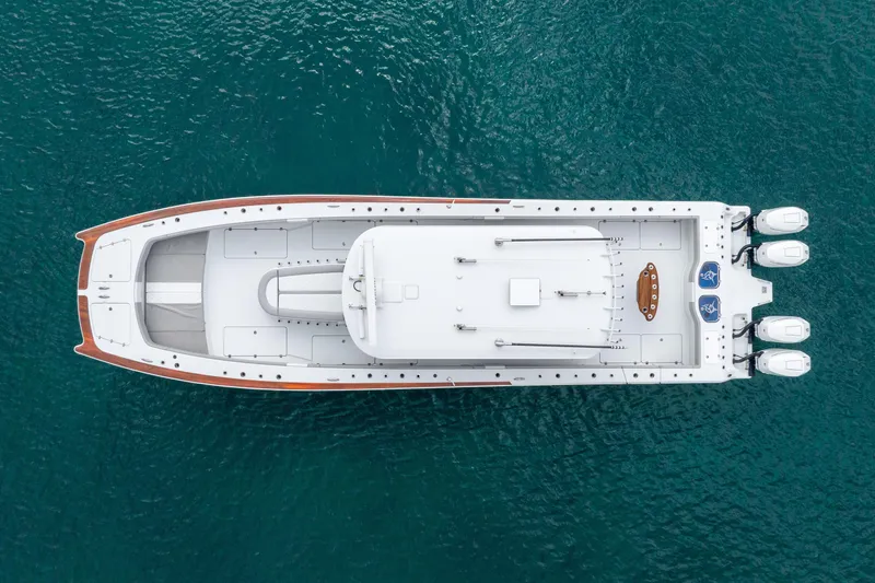 Slide: The Image of Aerial view of 2024 Freeman 47 boat on clear blue water. - 22