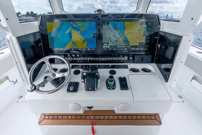 Slide: The Image of Cockpit of 2024 Freeman 47 boat with advanced navigation system and steering wheel. - 25