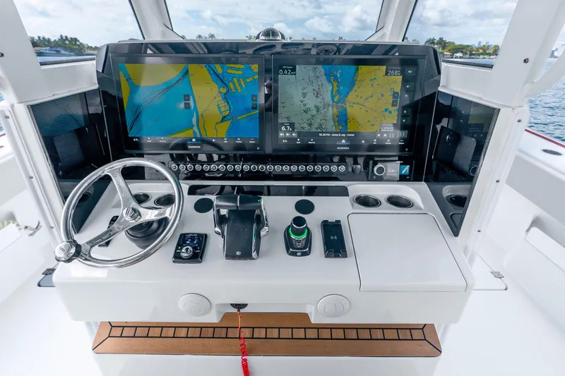 Slide: The Image of Helm of 2024 Freeman 47 boat with advanced navigation displays and controls. - 28