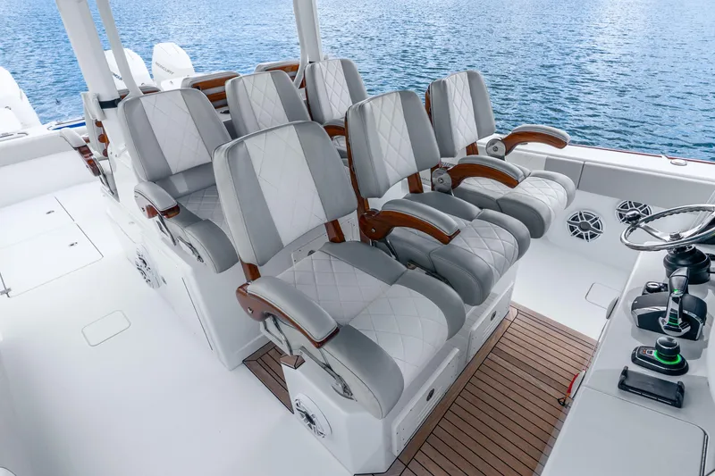 Slide: The Image of Luxury seating on 2024 Freeman 47 boat with elegant design and ocean backdrop. - 29