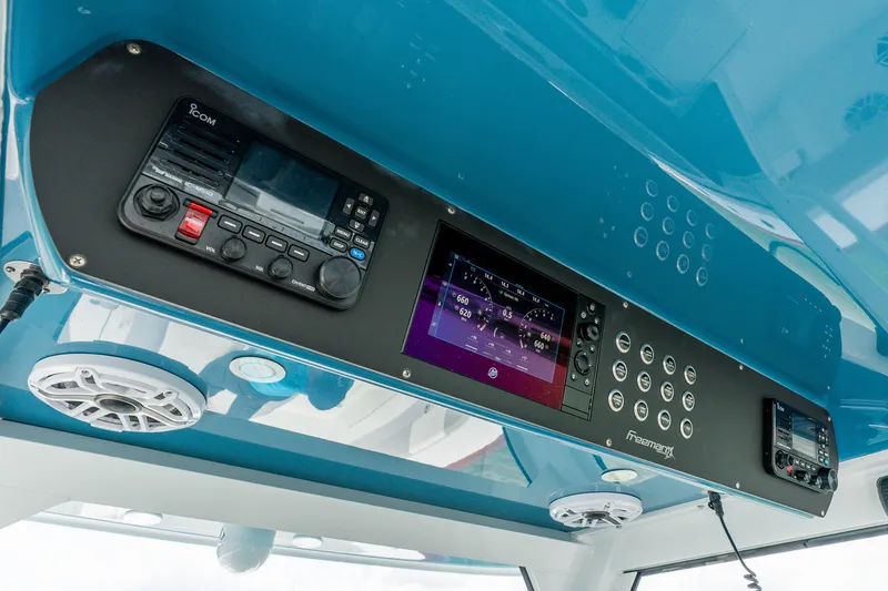 Slide: The Image of Control panel of 2024 Freeman 47 boat with navigation and communication systems. - 32