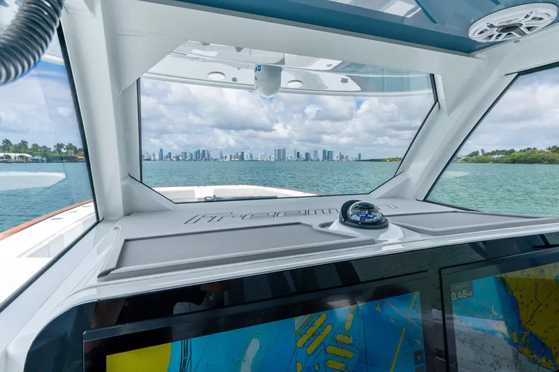 Slide: The Image of Interior view of 2024 Freeman 47 boat with city skyline in background. - 33