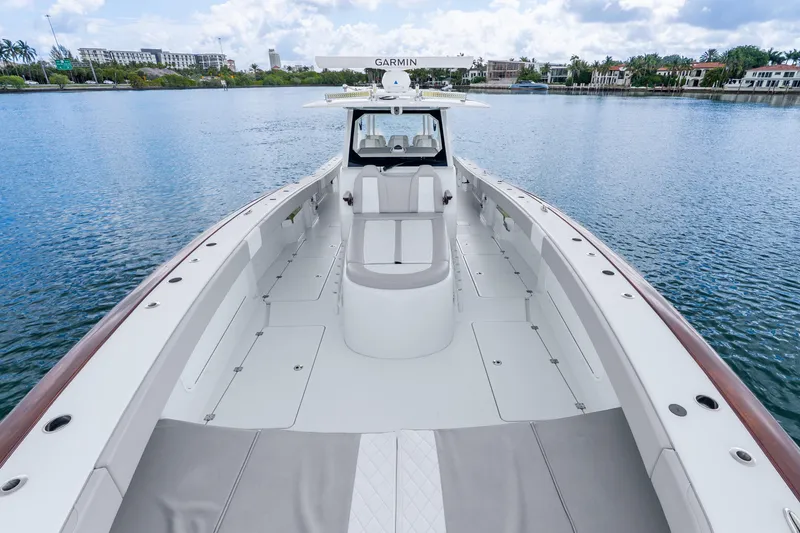 Slide: The Image of 2024 Freeman 47 boat on calm water, showcasing spacious deck and modern design. - 34