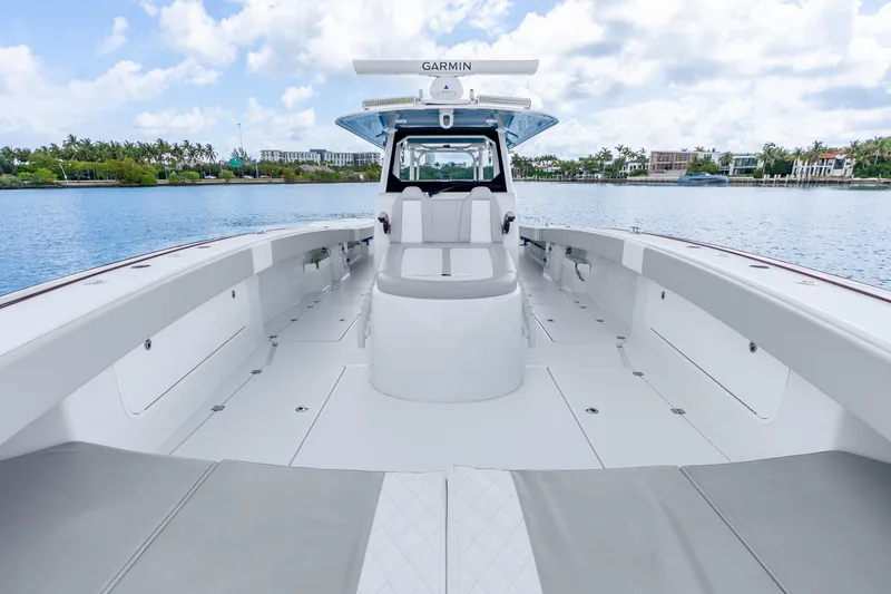 Slide: The Image of 2024 Freeman 47 boat interior with spacious deck and modern design on a calm waterway. - 35