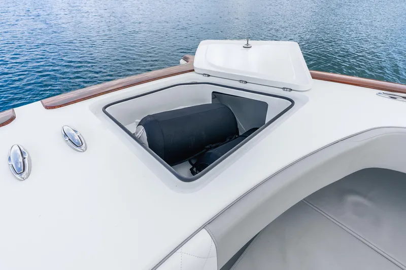 Slide: The Image of Open storage compartment on 2024 Freeman 47 boat, with ocean background. - 42
