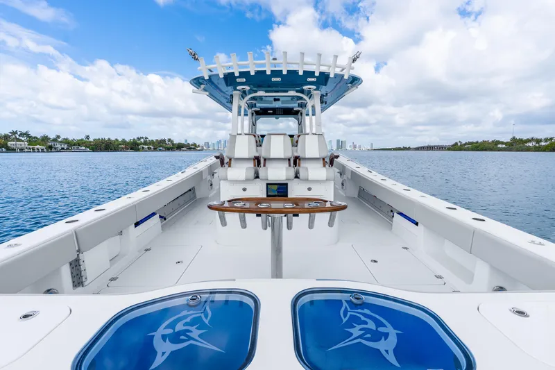 Slide: The Image of 2024 Freeman 47 boat on water, featuring spacious deck and modern design. - 44