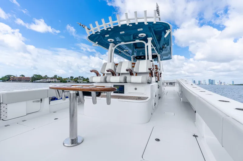 Slide: The Image of 2024 Freeman 47 boat with sleek design, spacious deck, and modern seating on open water. - 45