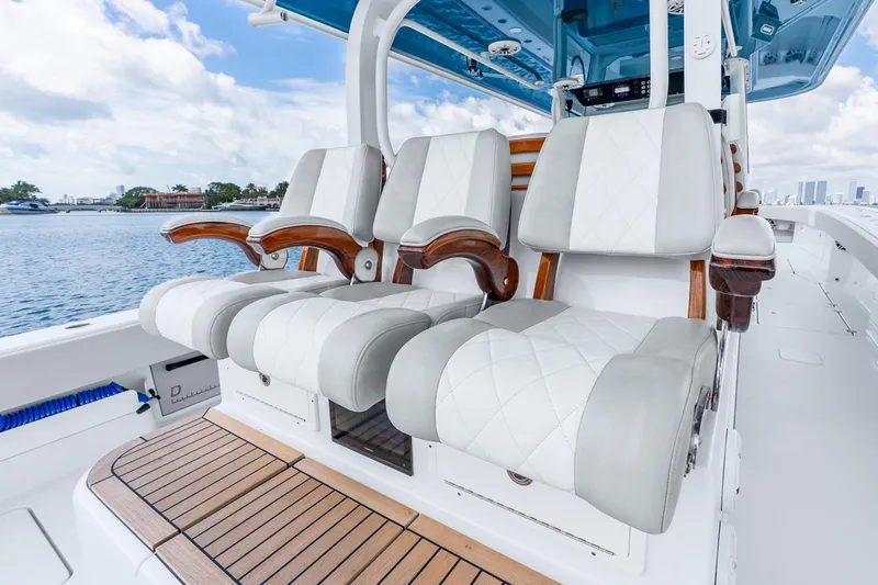 Slide: The Image of Luxury seating on 2024 Freeman 47 boat with elegant design and waterfront view. - 46