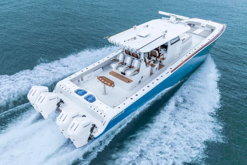 Slide: The Image of 2024 Freeman 47 boat cruising on open water with powerful engines. - 6