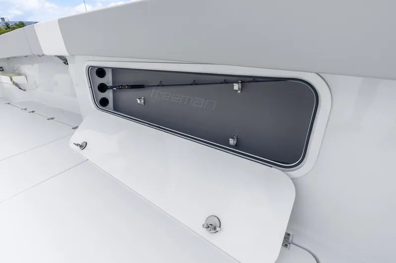 Slide: The Image of 2024 Freeman 47 boat storage compartment with sleek design and secure latches. - 63