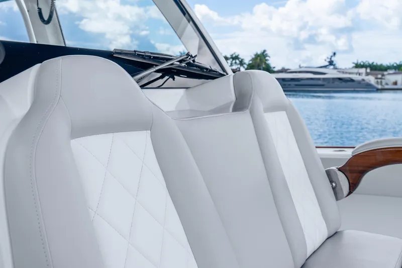 Slide: The Image of Luxurious seating on a 2024 Freeman 47 boat, with elegant white upholstery. - 64