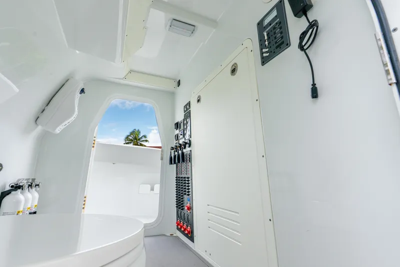 Slide: The Image of Interior of 2024 Freeman 47 boat with control panel and fire extinguishers. - 71