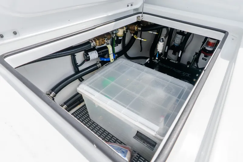 Slide: The Image of Storage compartment with hoses and equipment in a 2024 Freeman 47 boat. - 73