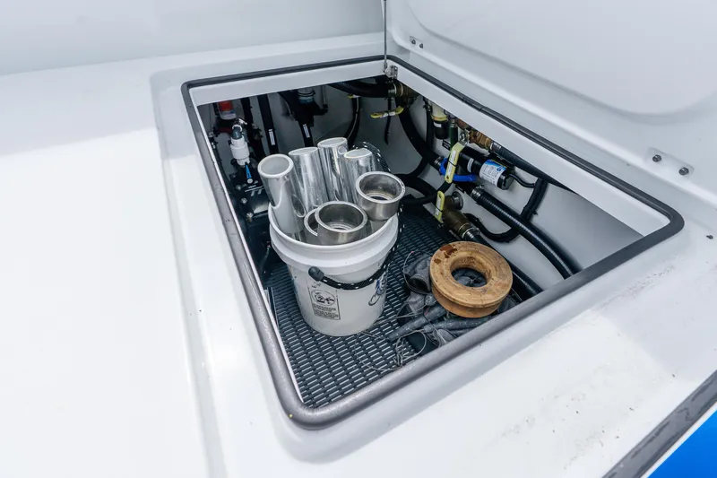Slide: The Image of Storage compartment of a 2024 Freeman 47 boat with equipment and tools. - 74