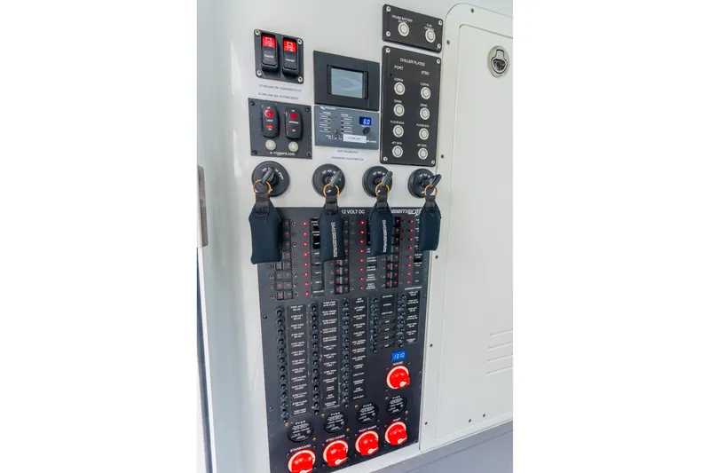 Slide: The Image of Control panel of a 2024 Freeman 47 boat with switches and indicators. - 76