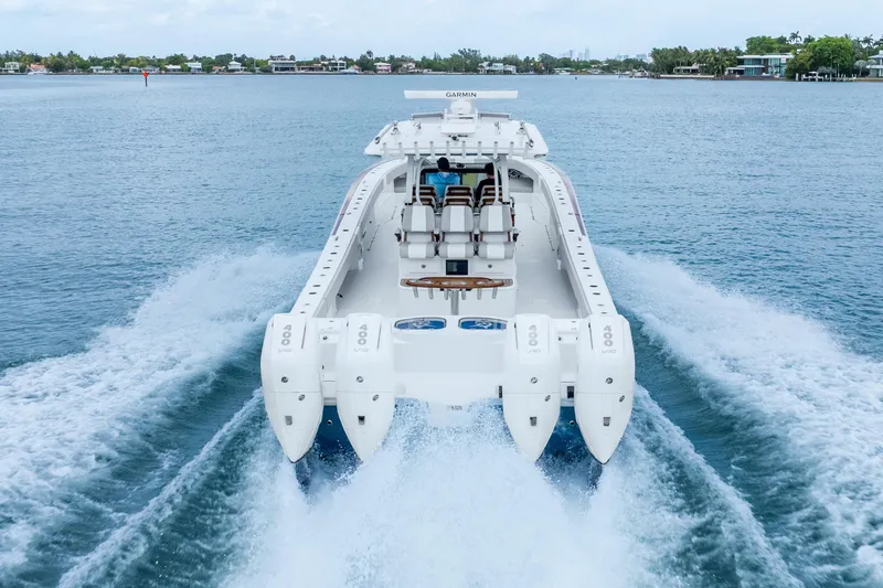 Slide: The Image of 2024 Freeman 47 boat cruising on water with powerful engines. - 8