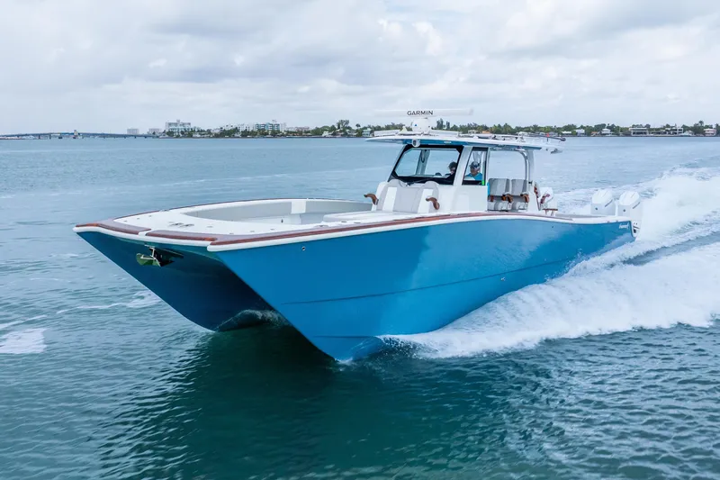 Slide: The Image of 2024 Freeman 47 boat cruising on open water, showcasing sleek design and powerful performance. - 9