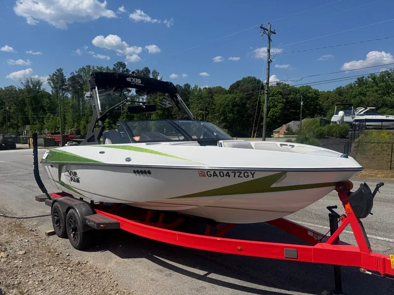 The Image of 2016 Axis T22 boat on red trailer, sunny day. - 1