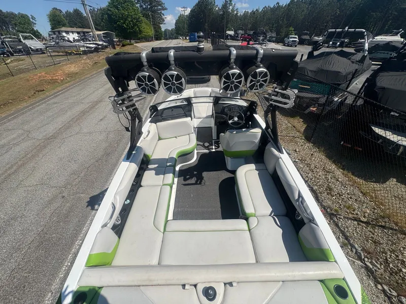 Slide: The Image of 2016 Axis T22 boat with speakers and outdoor seating. - 12