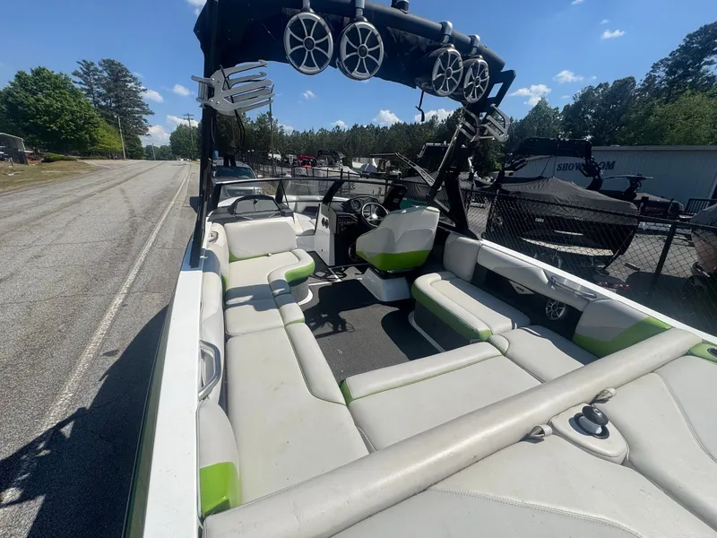 Slide: The Image of 2016 Axis T22 boat with speakers and seating on a road. - 13